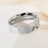 A thick, plain platinum wedding ring with a flat court profile