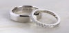 Wedding rings with engravings – men's plain band and women's scallop band in platinum.