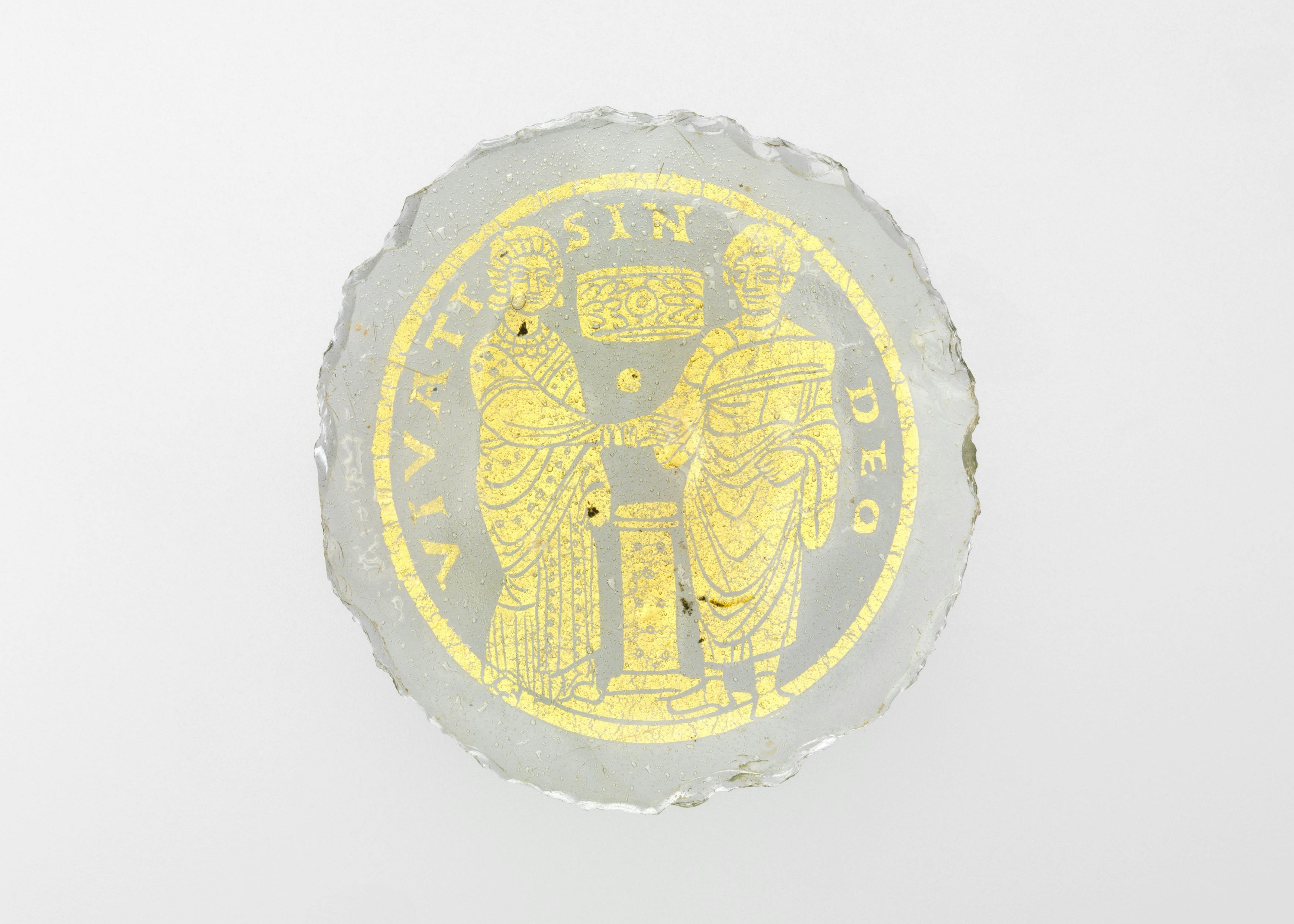 Bowl Base with a Marriage Scene, The couple stands in the traditional Roman marriage pose. The crown and the inscription indicate that they may be Christians.