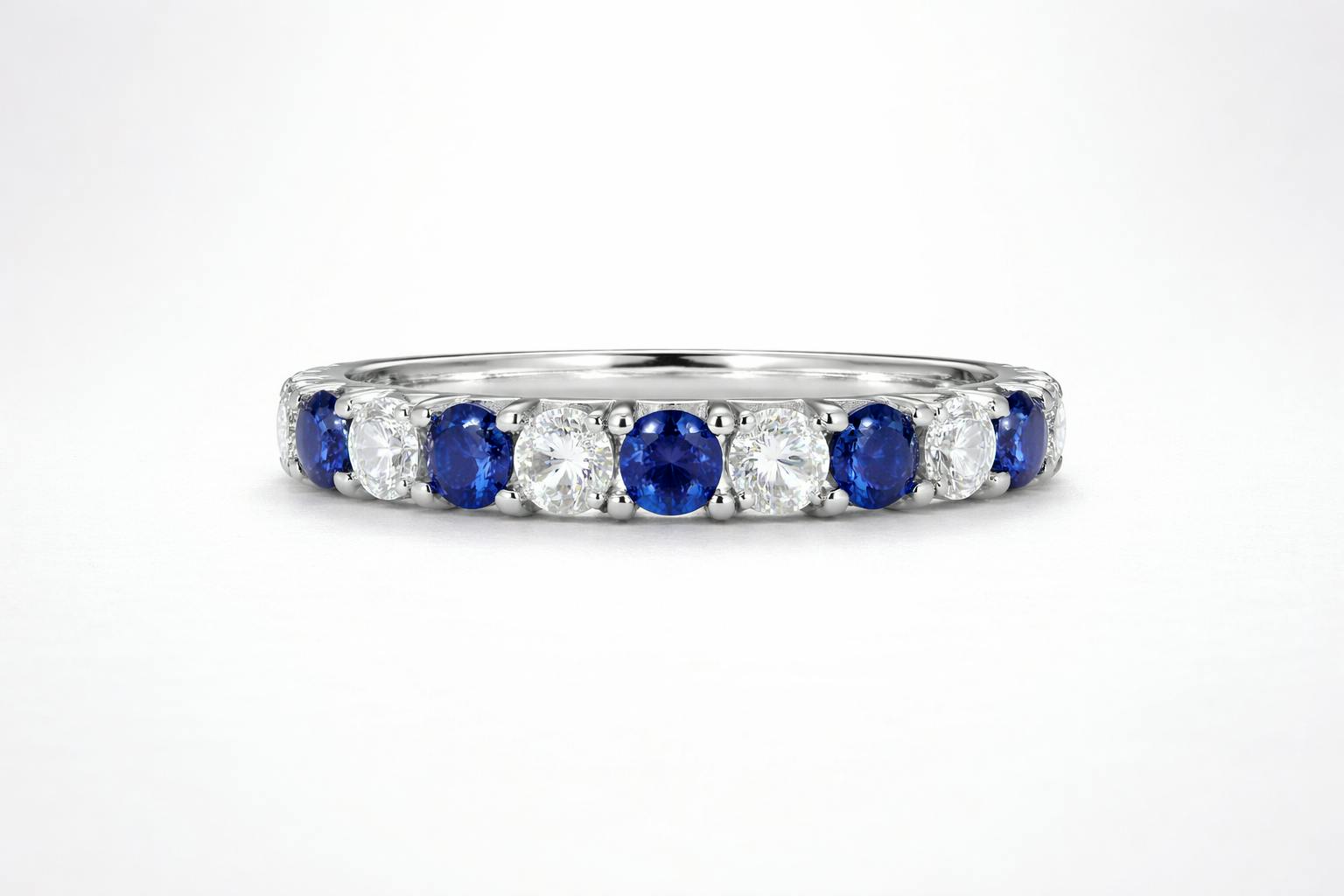 Render of Carolyn Bessette's diamond and sapphire engagement eternity ring in platinum.