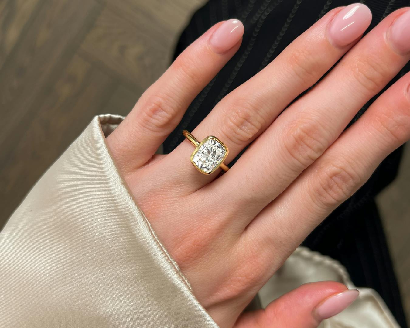 Elongated cushion cut diamond engagement ring in yellow gold.