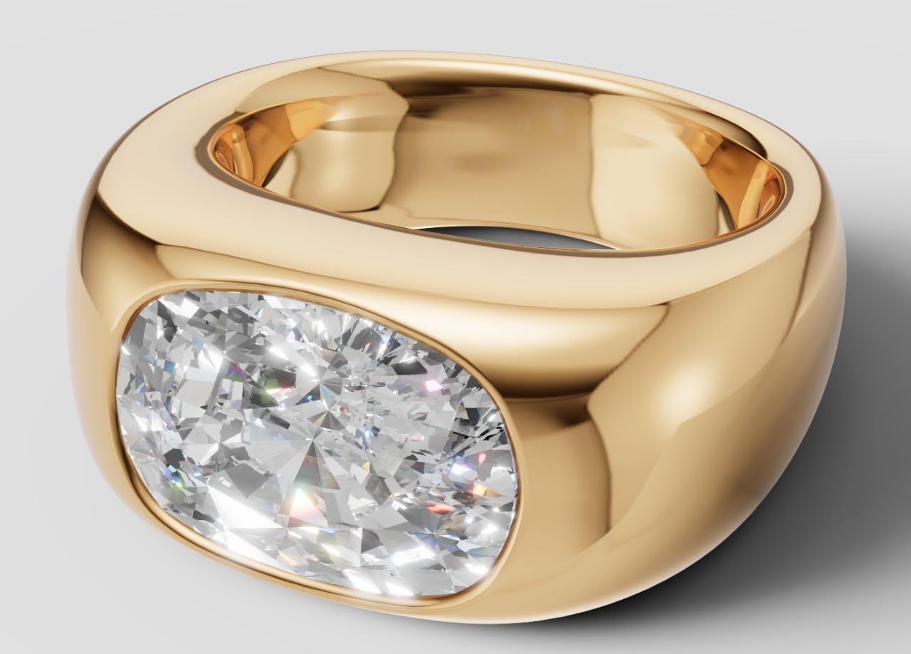 Downward side angled Queensmith render of Miley Cyrus's engagement ring with an elongated cushion cut diamond, set east-to-west on a chunky yellow gold bezel band.