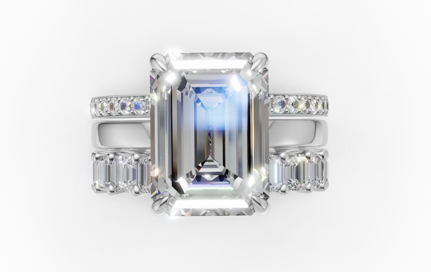 Render of Sofia Richie's emerald cut diamond engagement ring, stacked with two platinum diamond wedding bands.