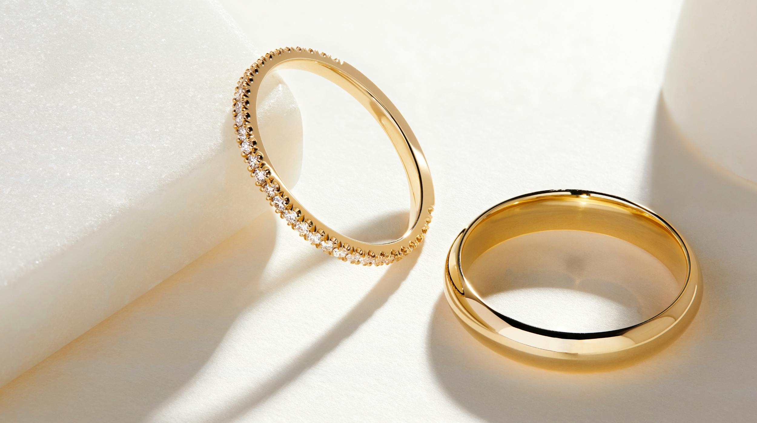 Yellow gold diamond wedding band and simple, plain wedding ring.