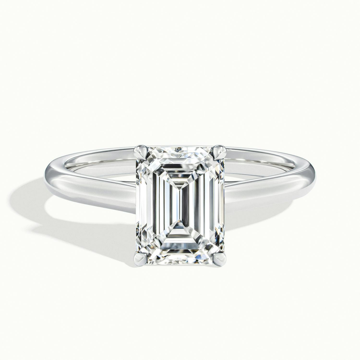 Exquisite platinum ring with emerald cut blue sapphire -